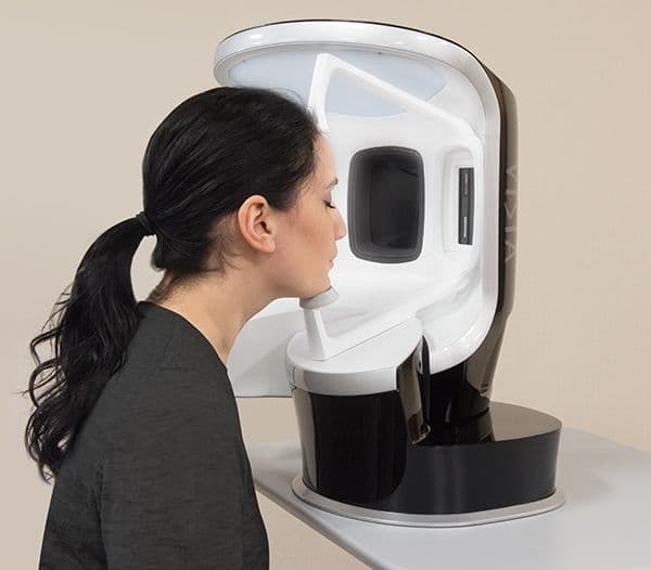 Woman receiving VISIA Skin Analysis assessment