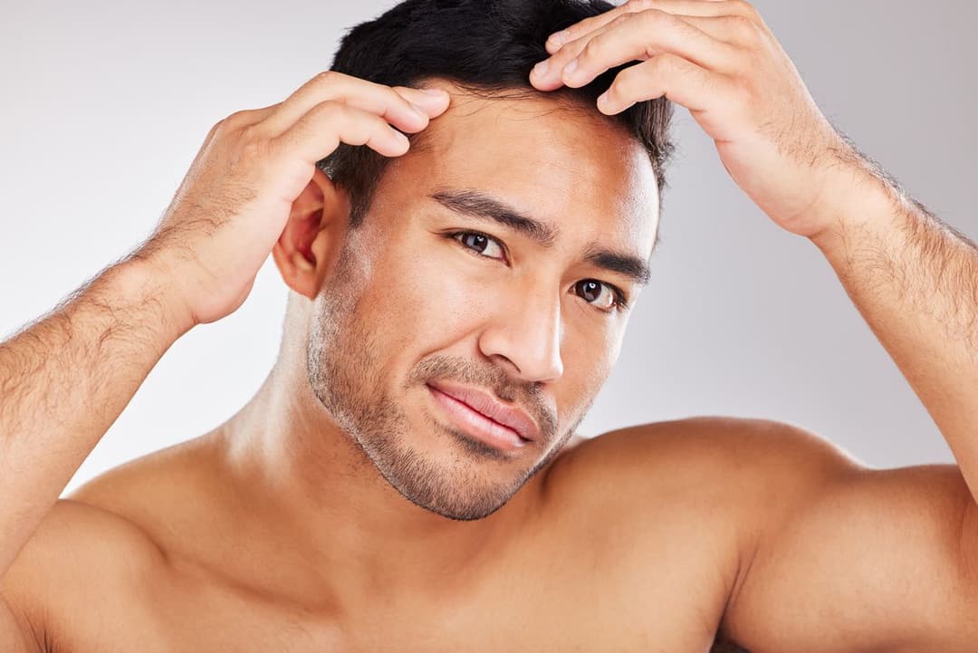 Man admiring clear skin